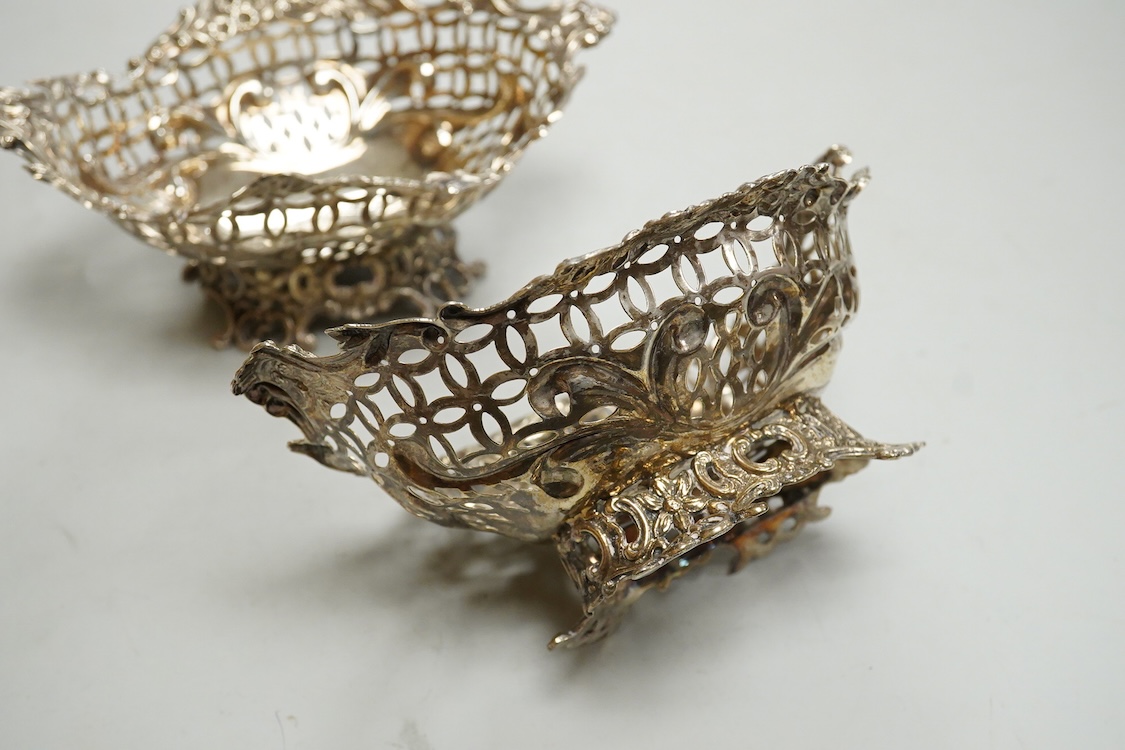 A pair of late Victorian pierced silver boat shaped bonbon dishes, with engraved monogram, by Charles Boyton II, London, 1897, length 16.4cm, 7.3oz.